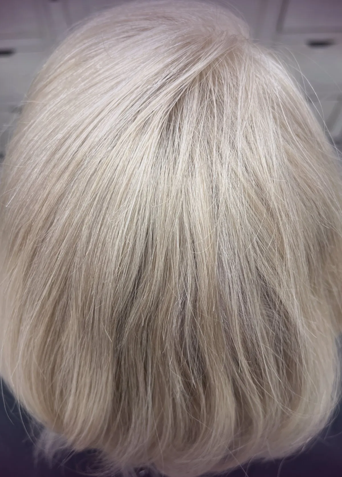 After a custom hair topper fitting, color-matched and blended into the client’s own hair